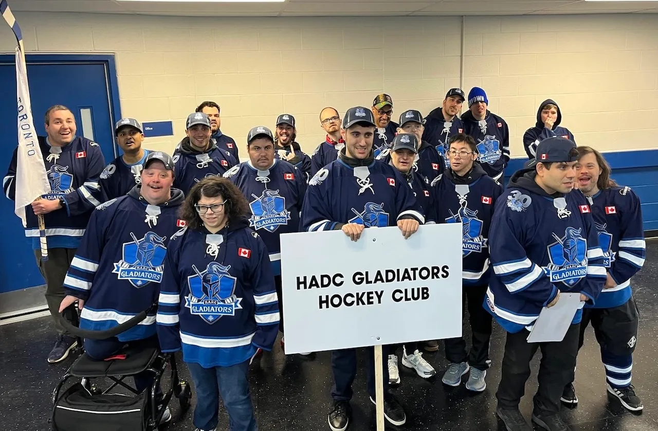 The HADC Gladiators team lined up behind their club sign